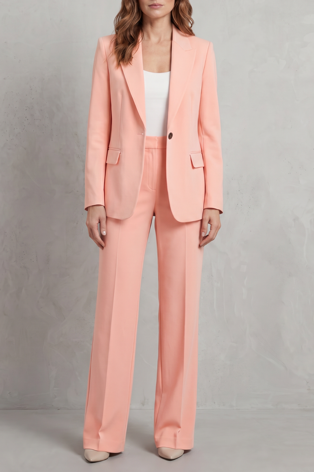 Pink colorway of the tailored blazer and pants suit set, full-length view
