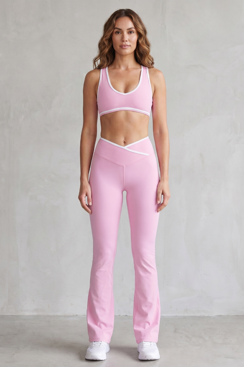 Blue colorway of the sports bra and flared leggings set, full-length view