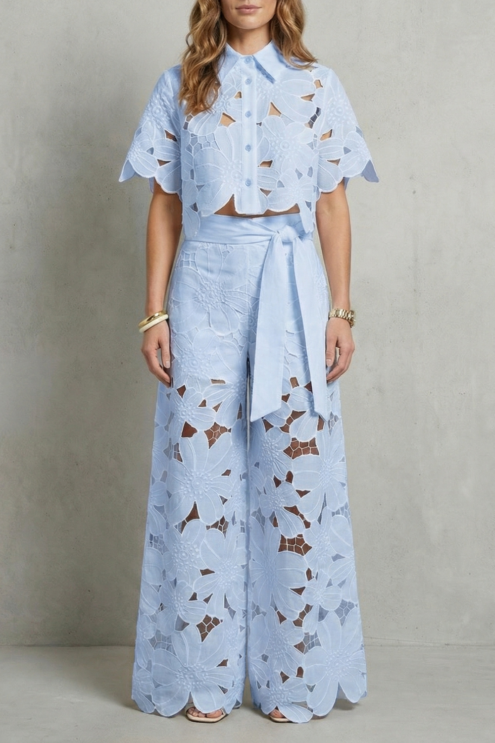 Close-up of the tie belt at the high-waisted skirt