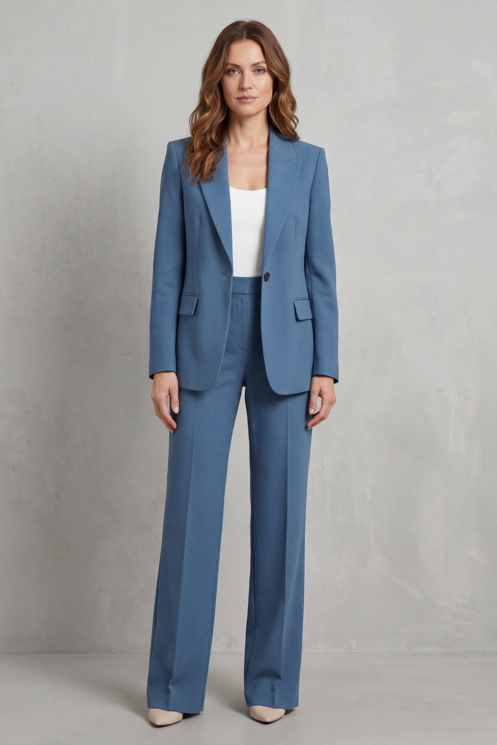 Side view of the structured blazer and high-rise straight-leg pants