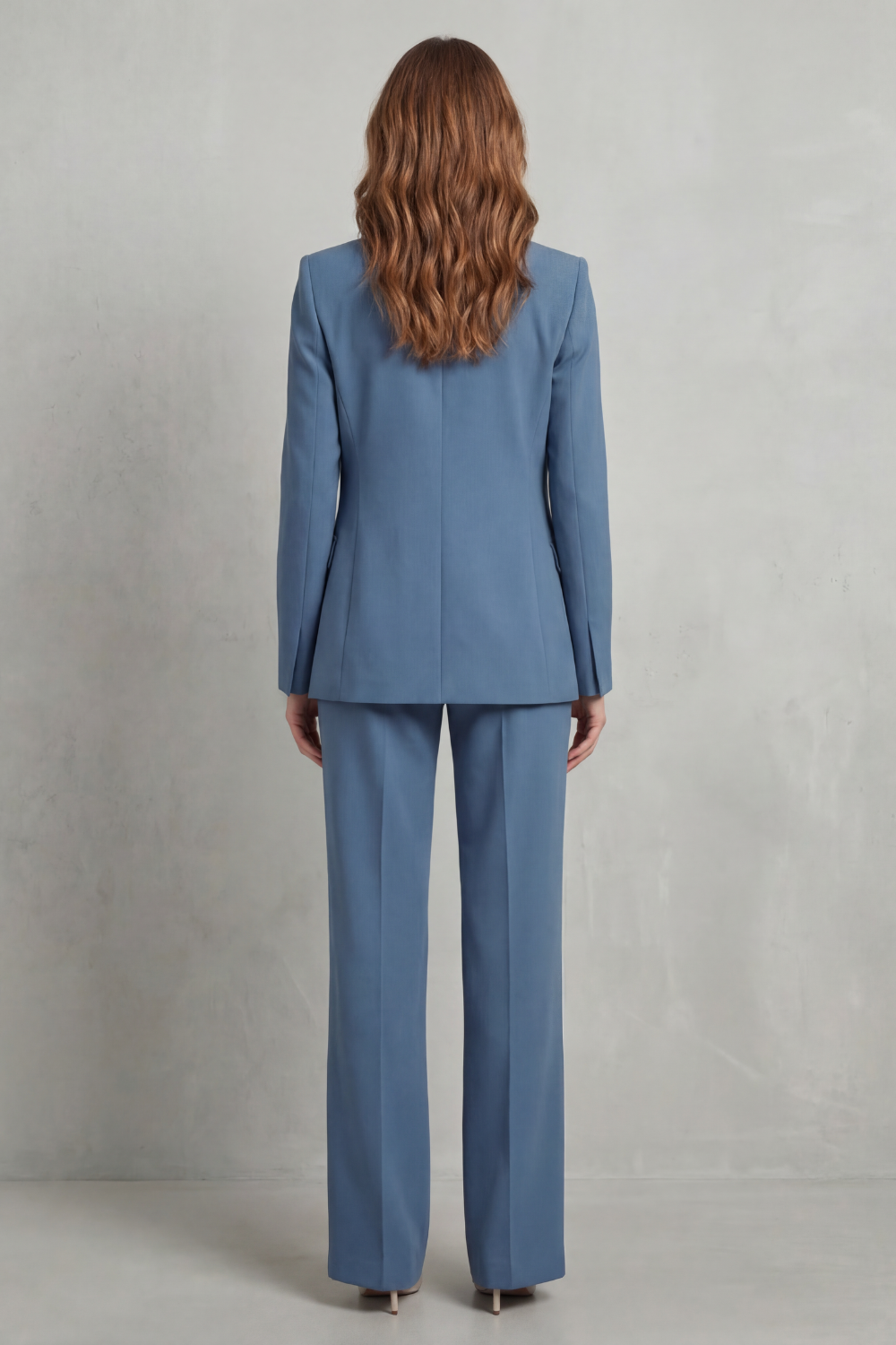 Detail close-up of the notched lapels and single-button closure