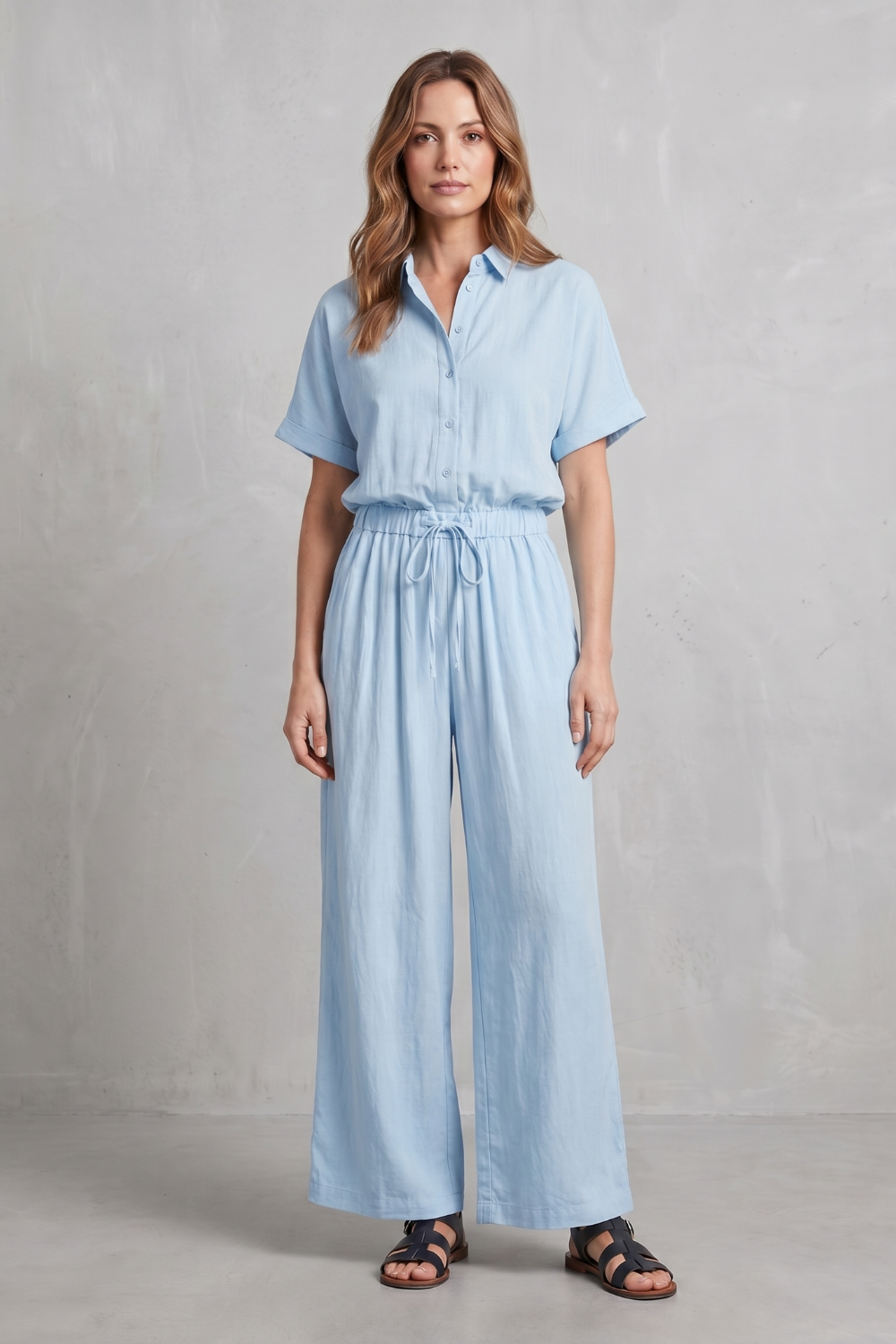 Side view of the relaxed short-sleeve top and flowing wide-leg pants
