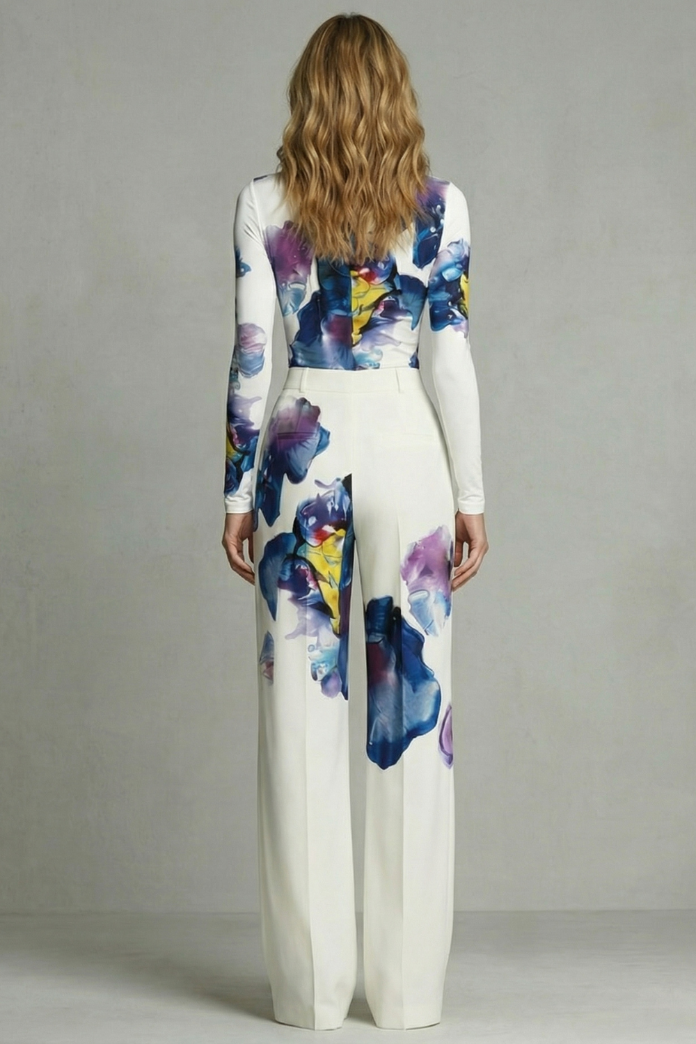 White colorway of the floral two-piece set styled with heeled sandals