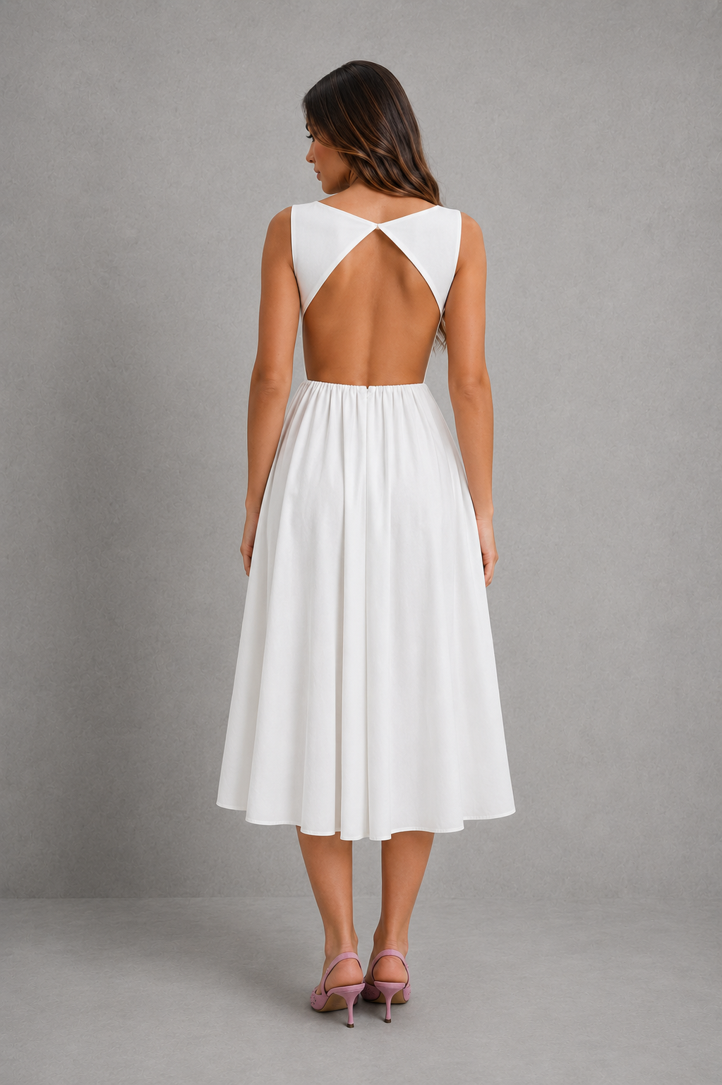 Womenโs elegant open-back midi dress with sleeveless fitted bodice, round neckline and flowing A-line skirt for weddings and evening wear.