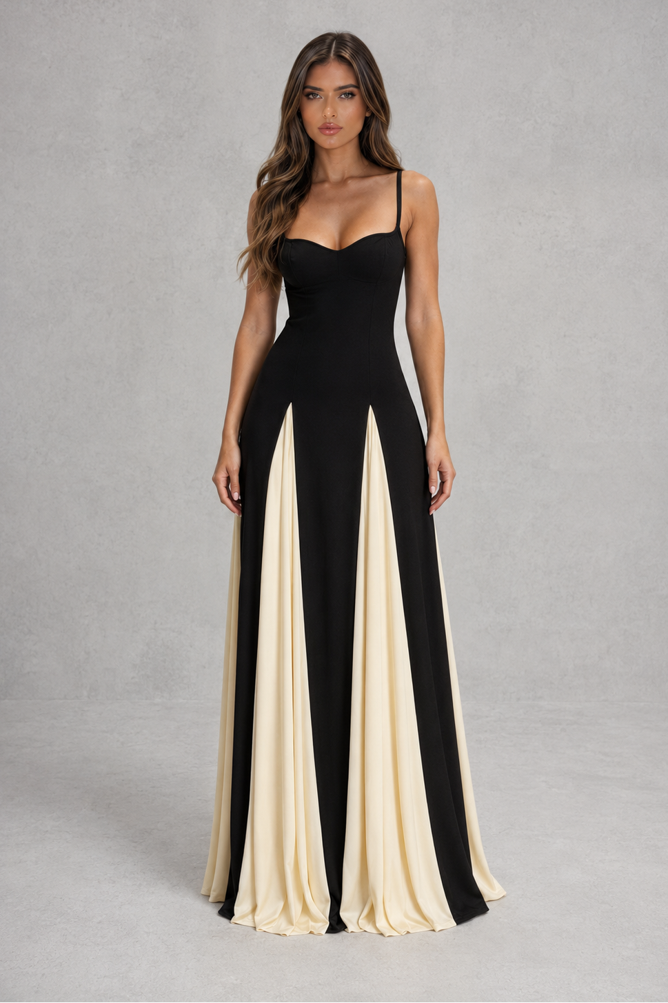 Womenโs two-tone maxi dress with sculpted fitted bodice, adjustable shoulder straps and flowing contrast skirt for elegant occasion wear.