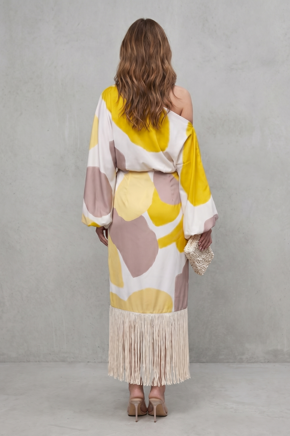 Detail close-up of the fringe hem on the abstract print two-piece set