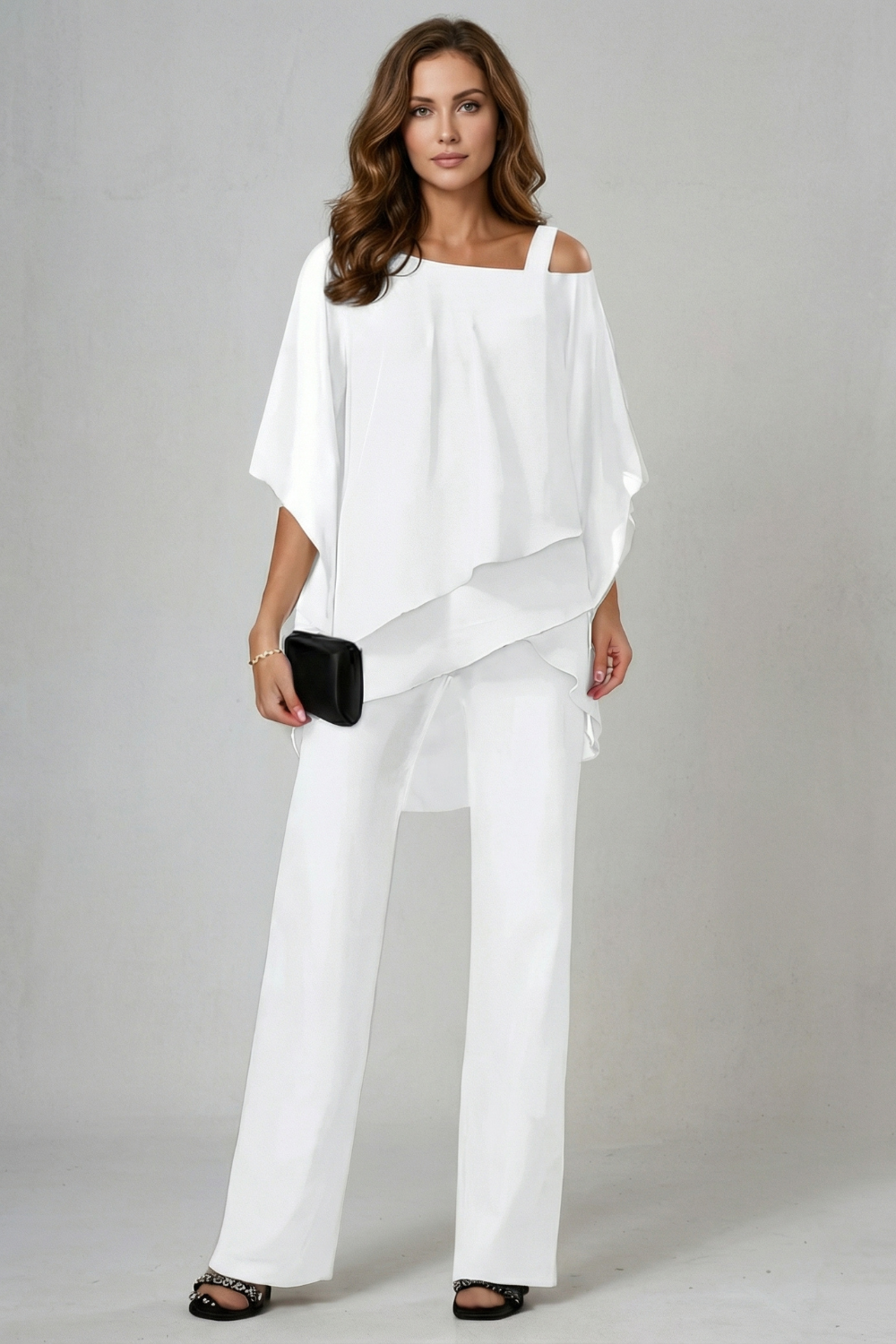 Side view of the asymmetric chiffon top and flowing wide-leg pants