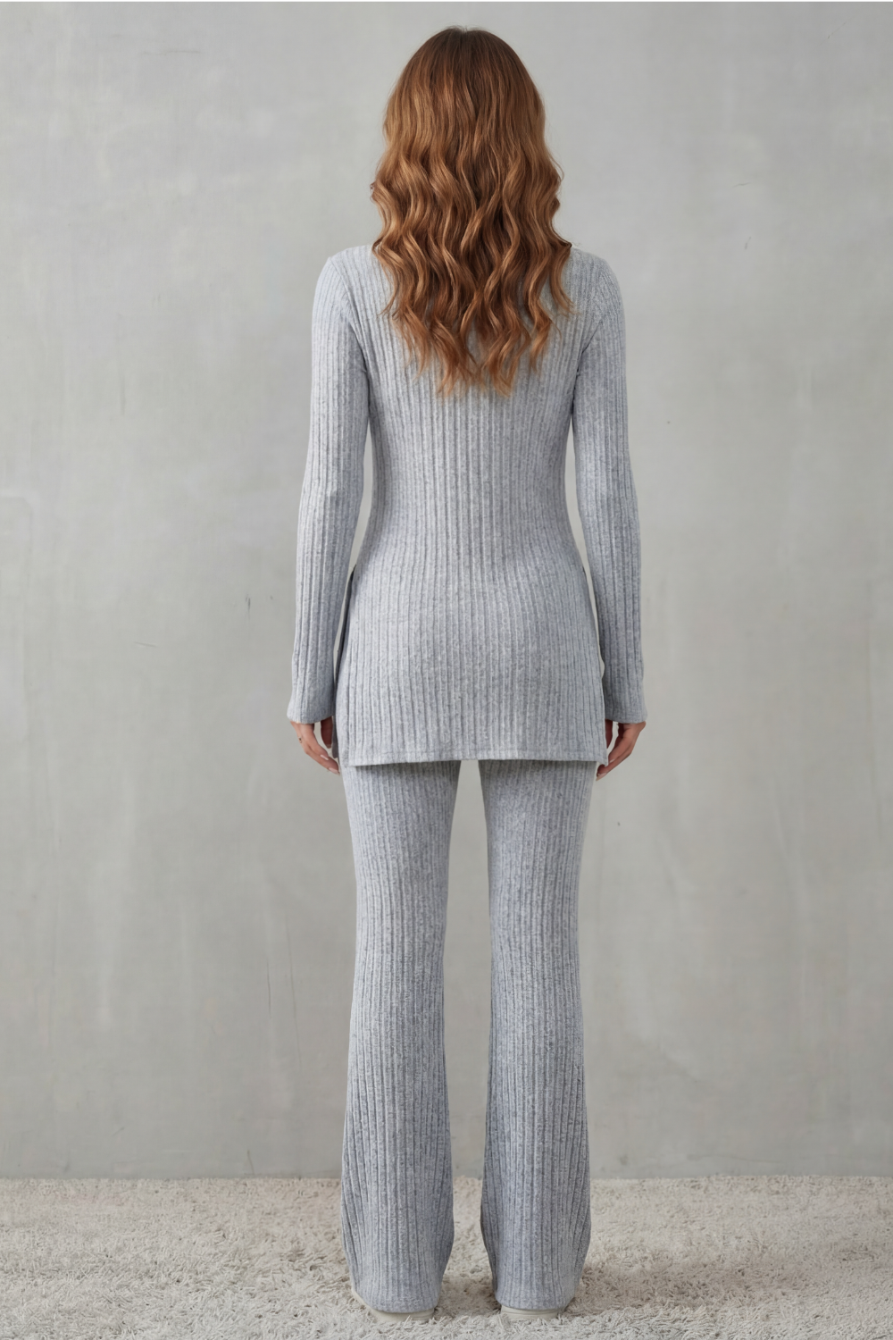 Detail close-up of the ribbed texture and round neckline on the tunic top