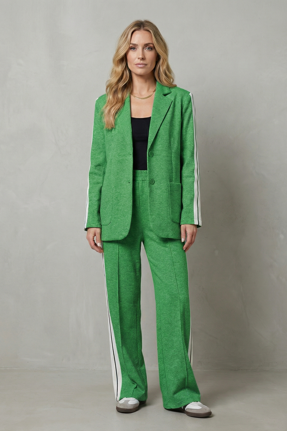 Suit set styled with sneakers for an off-duty look