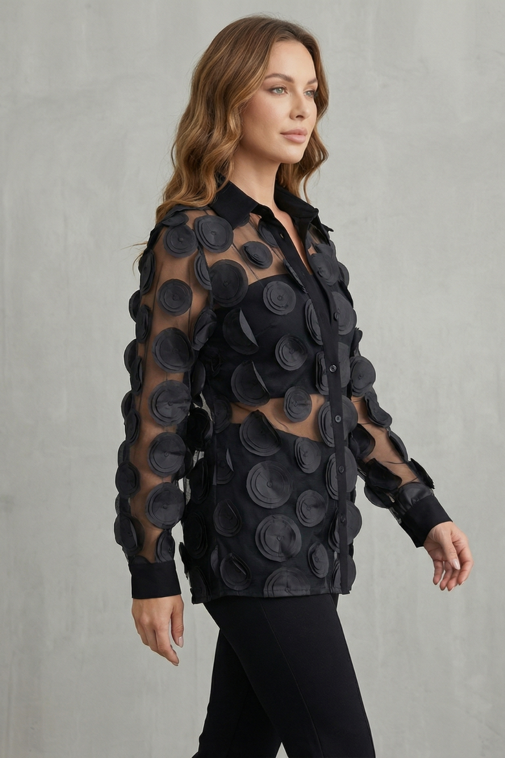Back view of the sheer mesh button-down blouse