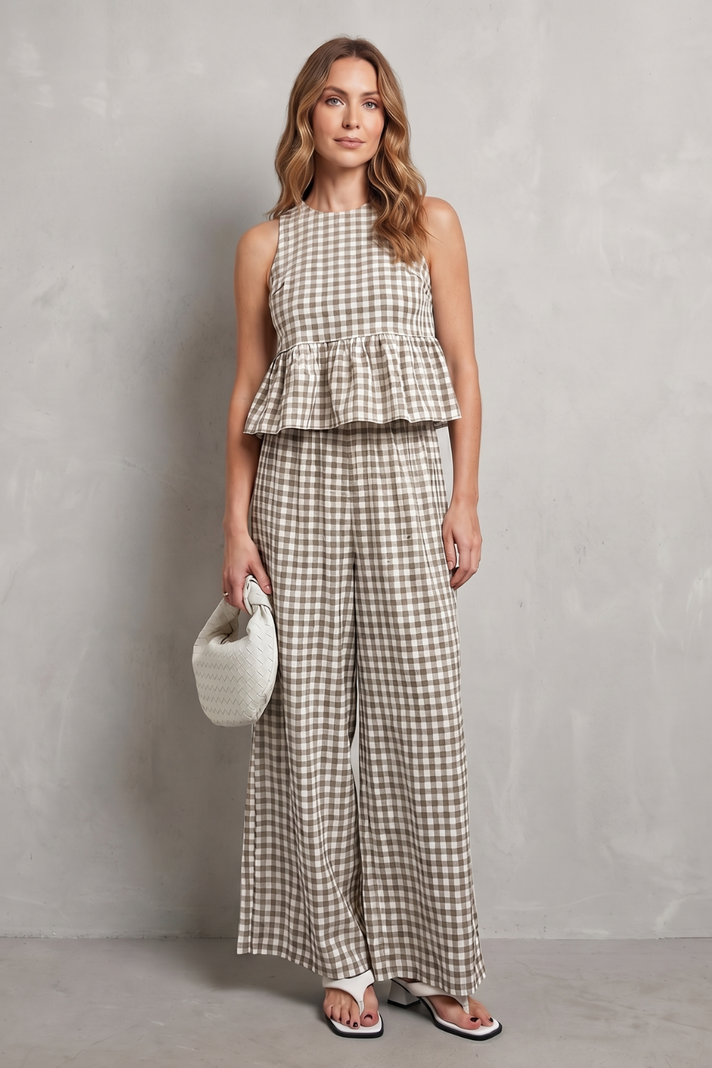 Pink colorway of the sleeveless gingham ruffle top and pants set