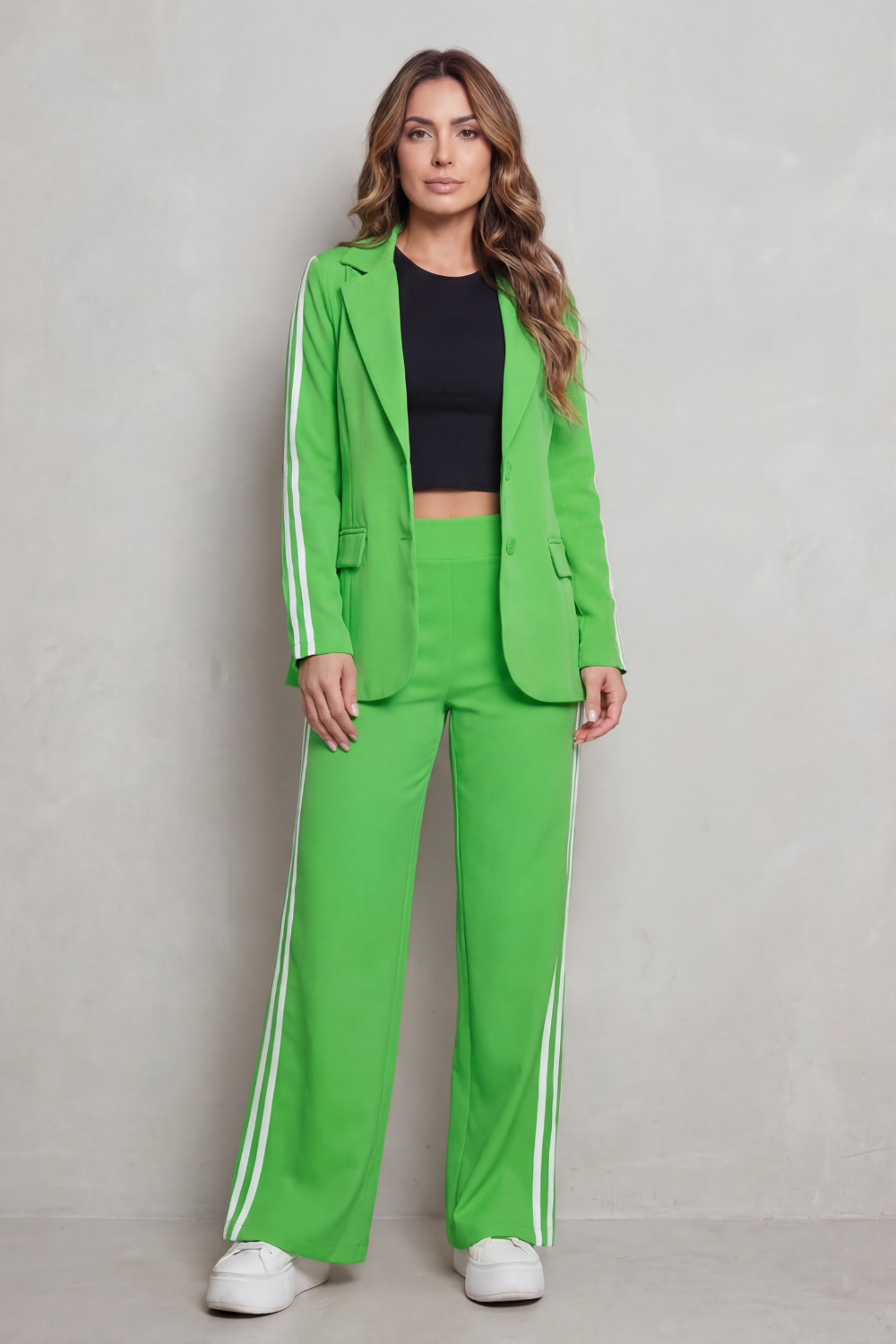 Suit set styled with a cropped tank and platform sneakers