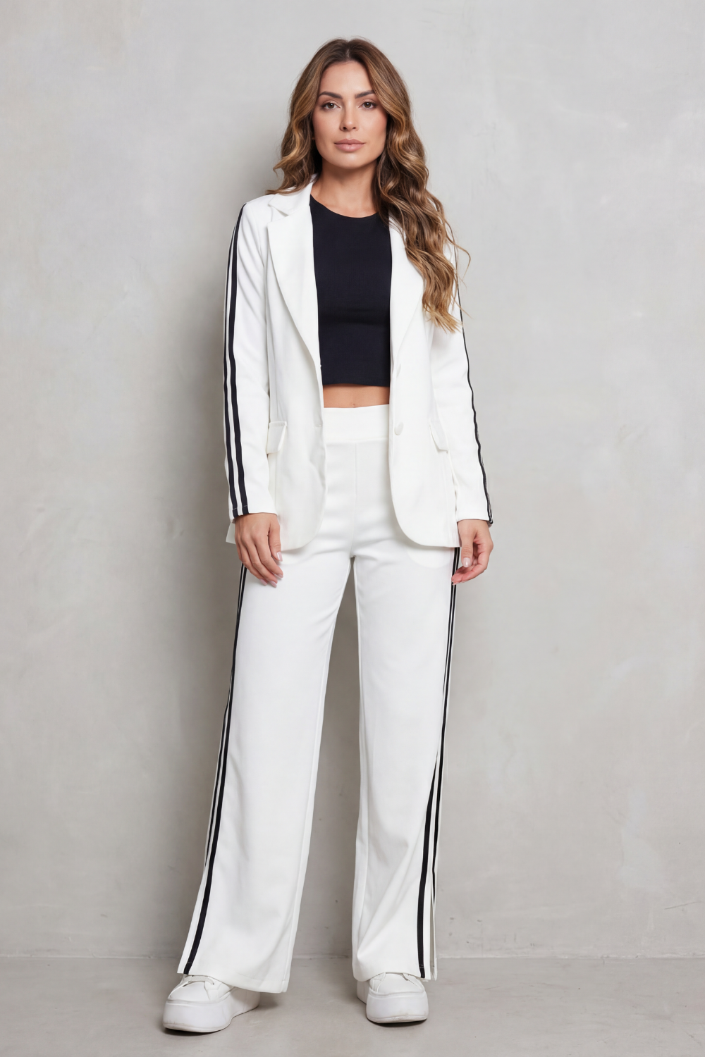 Side view of the tailored blazer and slit wide-leg pants