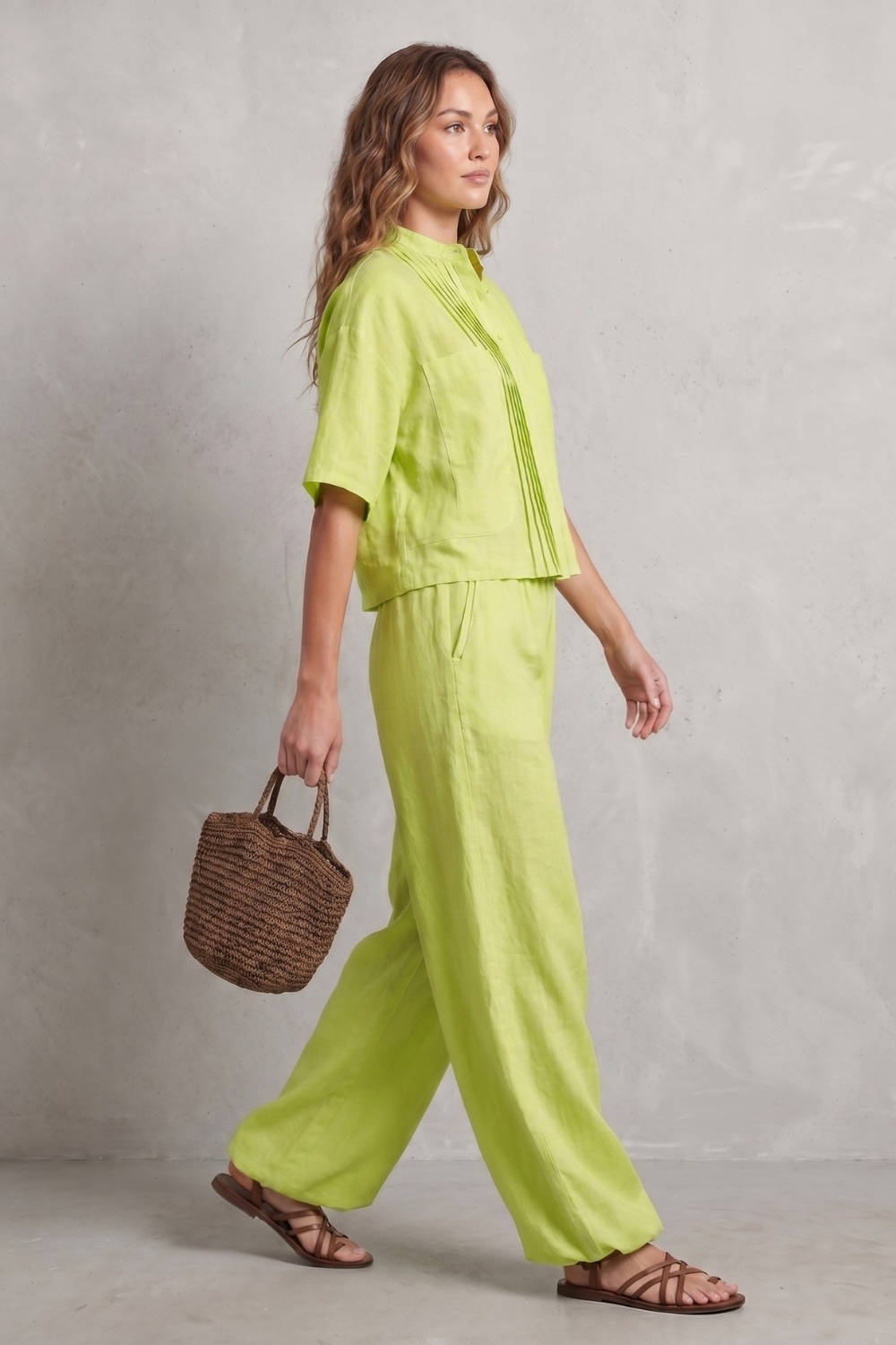 Back view of the two-piece pleated pants and shirt set