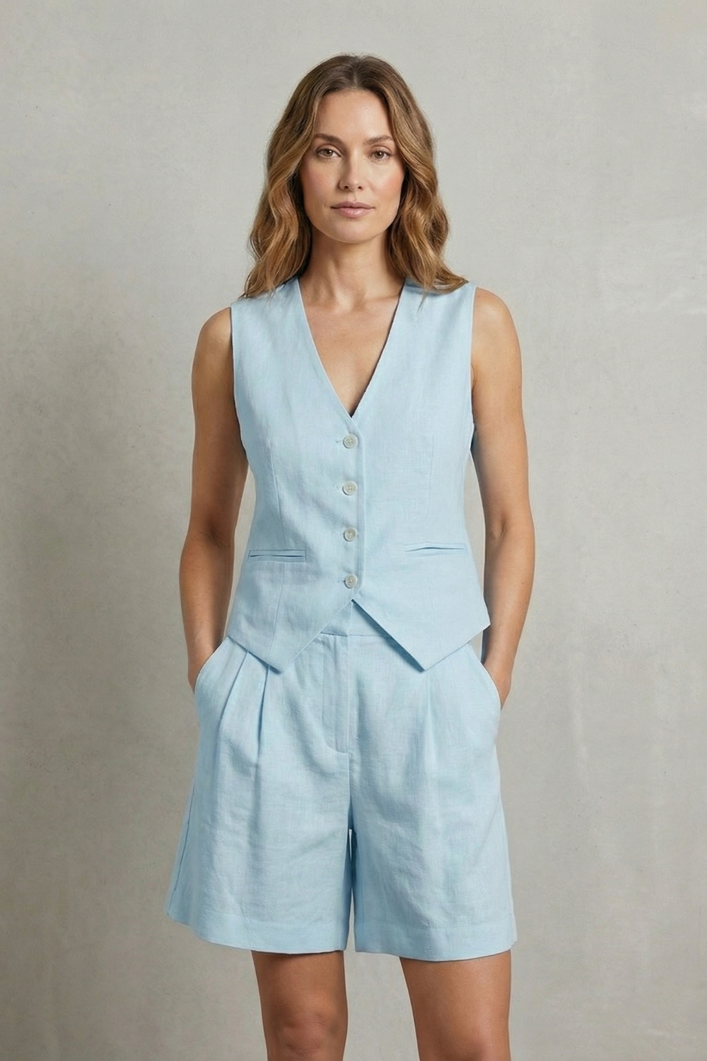 White colorway of the sleeveless vest and shorts set, full-length view