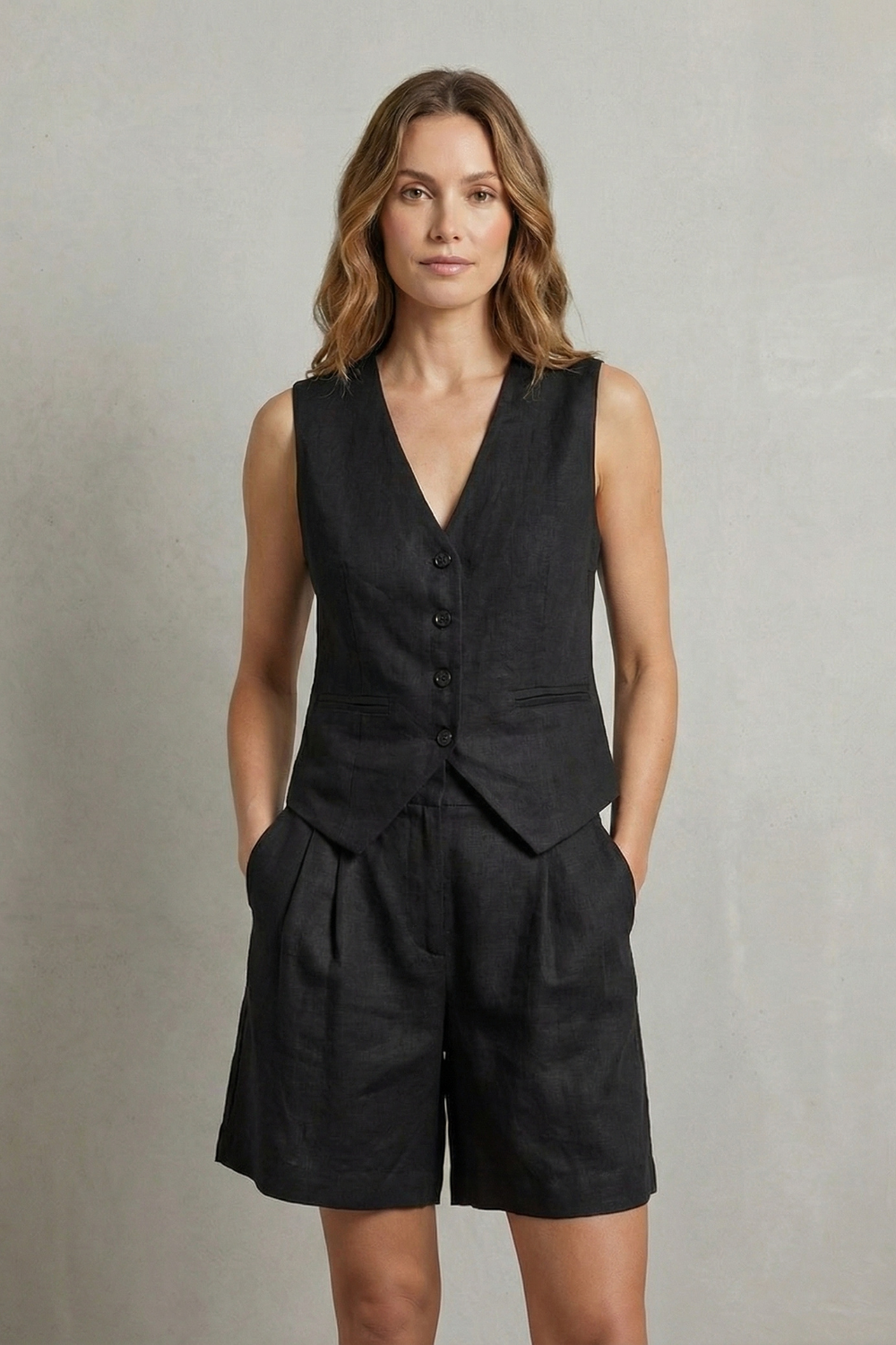 Black colorway of the sleeveless vest and shorts set, full-length view