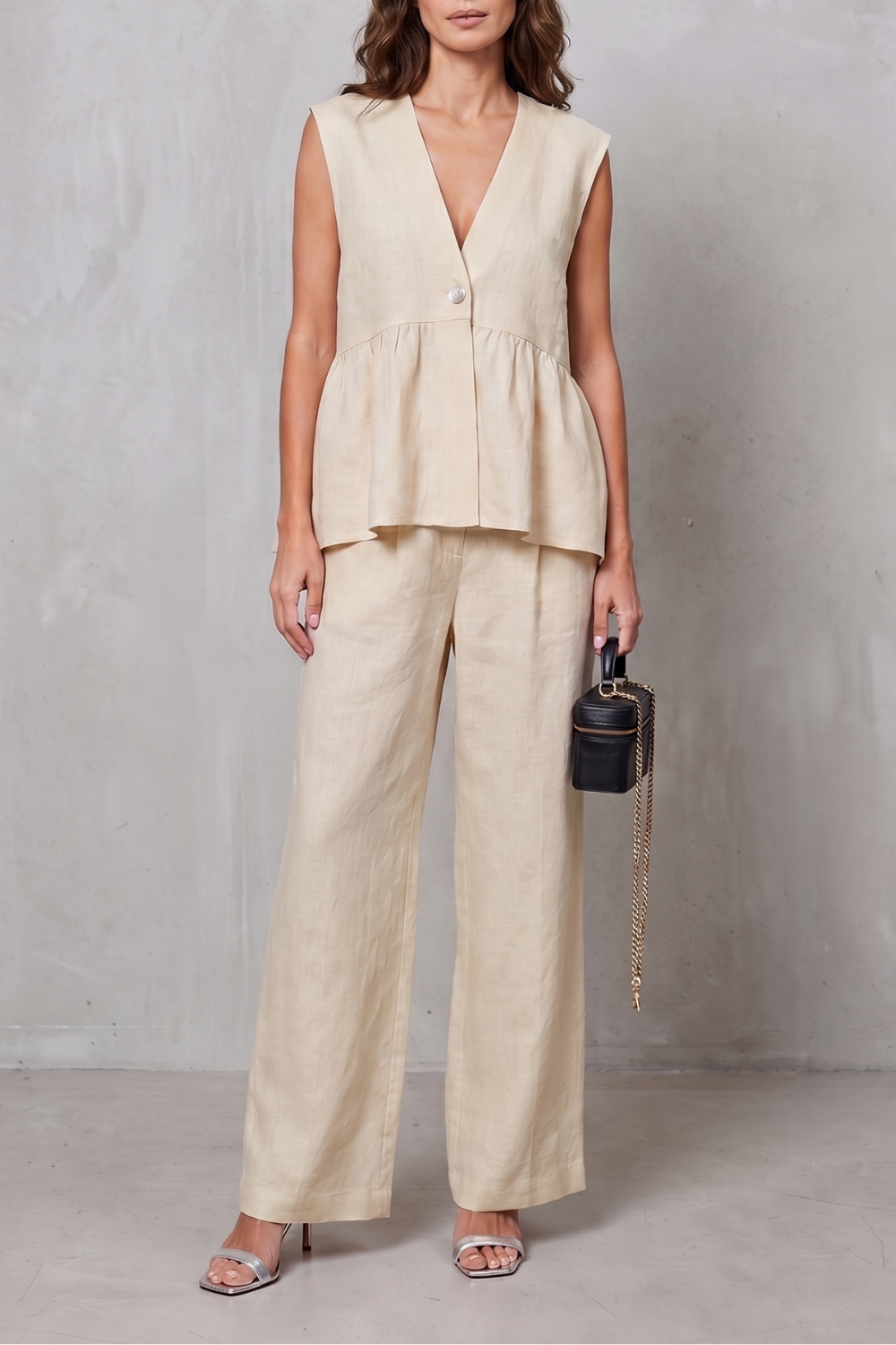 White colorway of the sleeveless peplum top and wide-leg pants