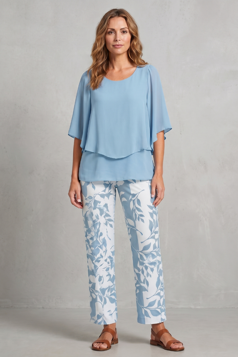Green colorway of the botanical print pants set, full-length view