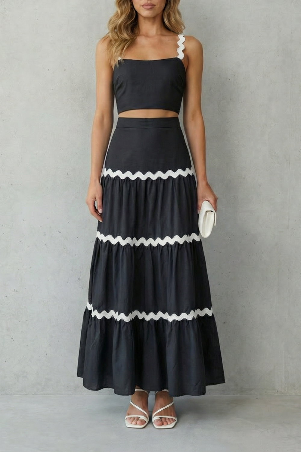 Detail close-up of the elastic waistband on the tiered maxi skirt