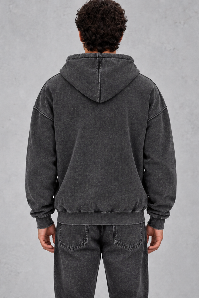 Men's zip hoodie worn open over a T-shirt with jeans