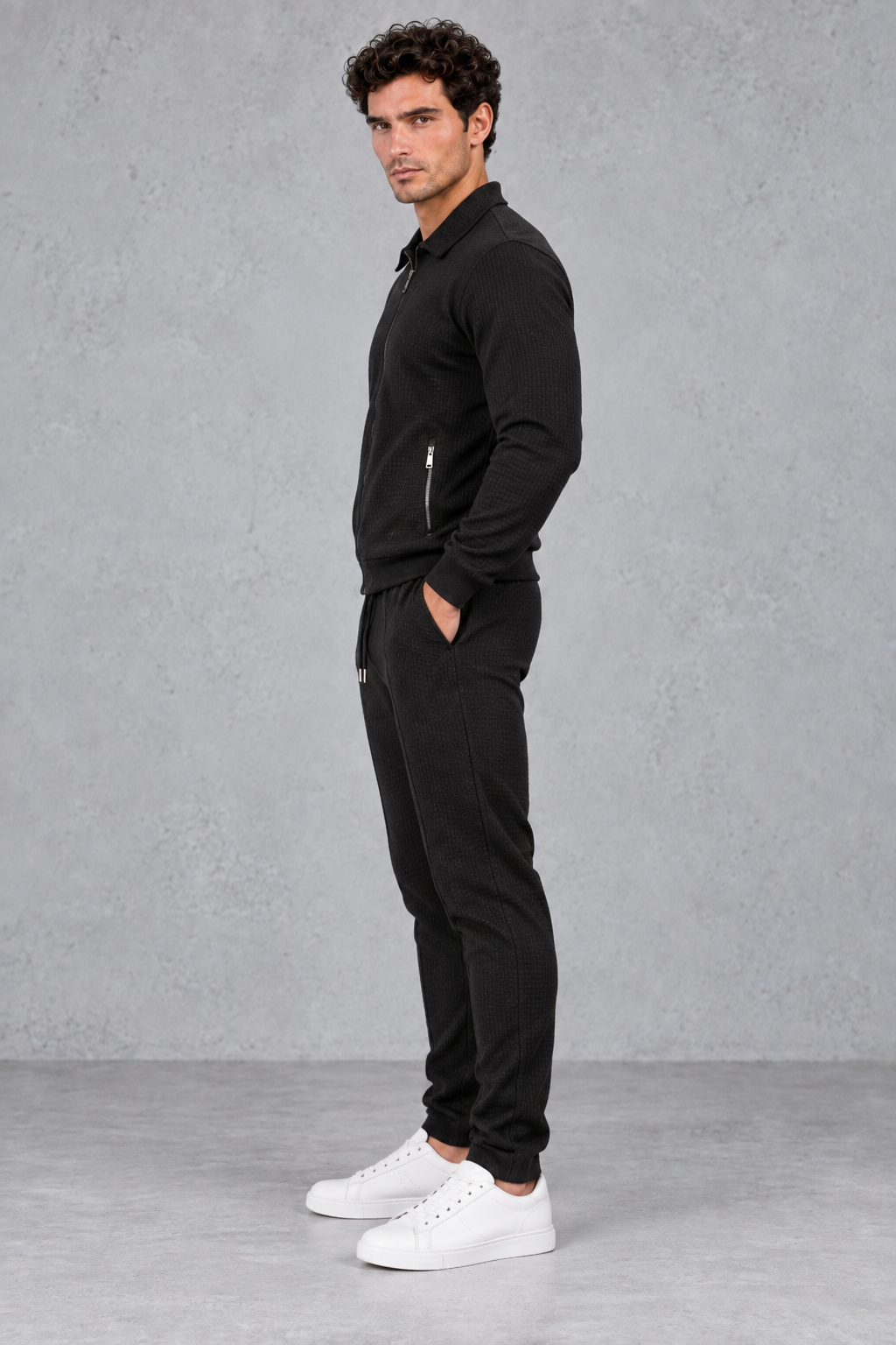 Back view of the men's textured tracksuit jacket with ribbed hem