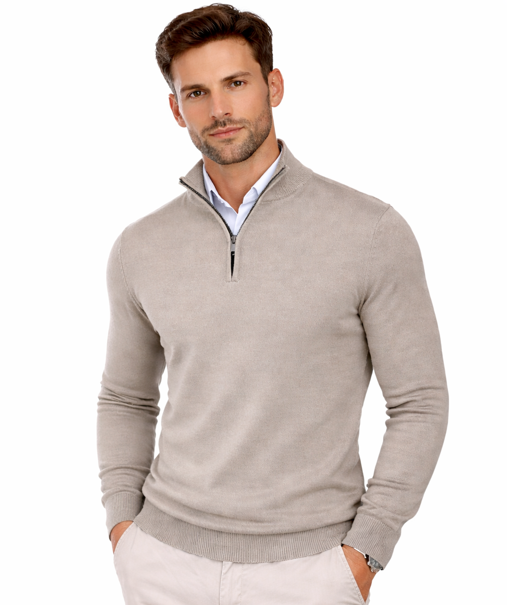 Man wearing a beige half-zip sweater on a white background