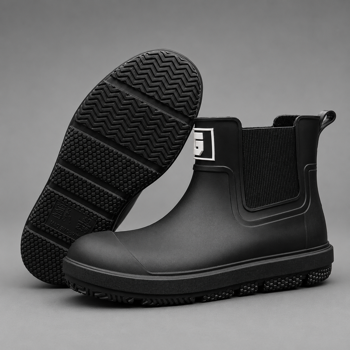 Men’s waterproof ankle boots with an easy pull-on design, durable rubber outsole, and slip-resistant tread for wet-weather wear.