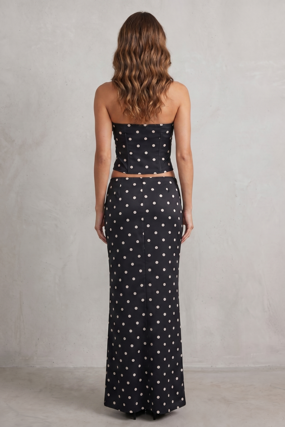 Black colorway, full-length view of the polka dot maxi skirt set