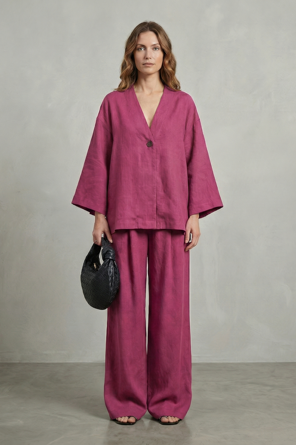Pink colorway of the wrap top and wide-leg pants set, full-length view