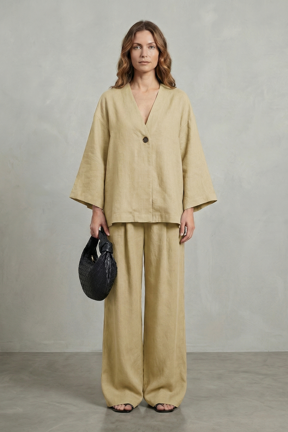 Wrap top and wide-leg pants set styled with flats for a relaxed city look