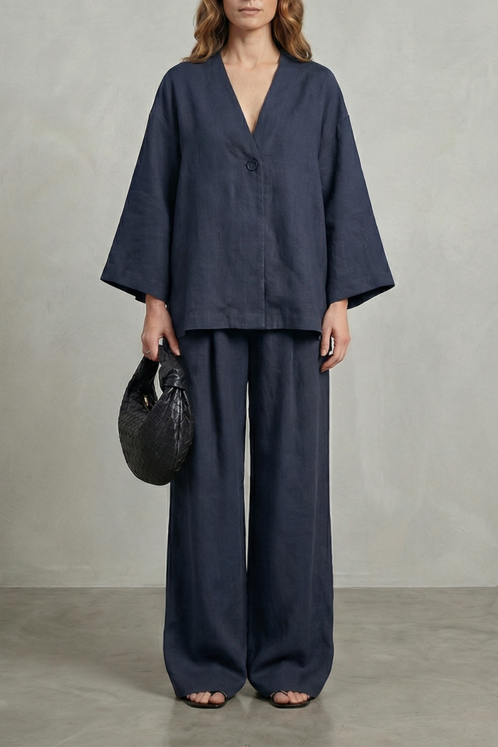Brown colorway of the wrap top and wide-leg pants set, full-length view