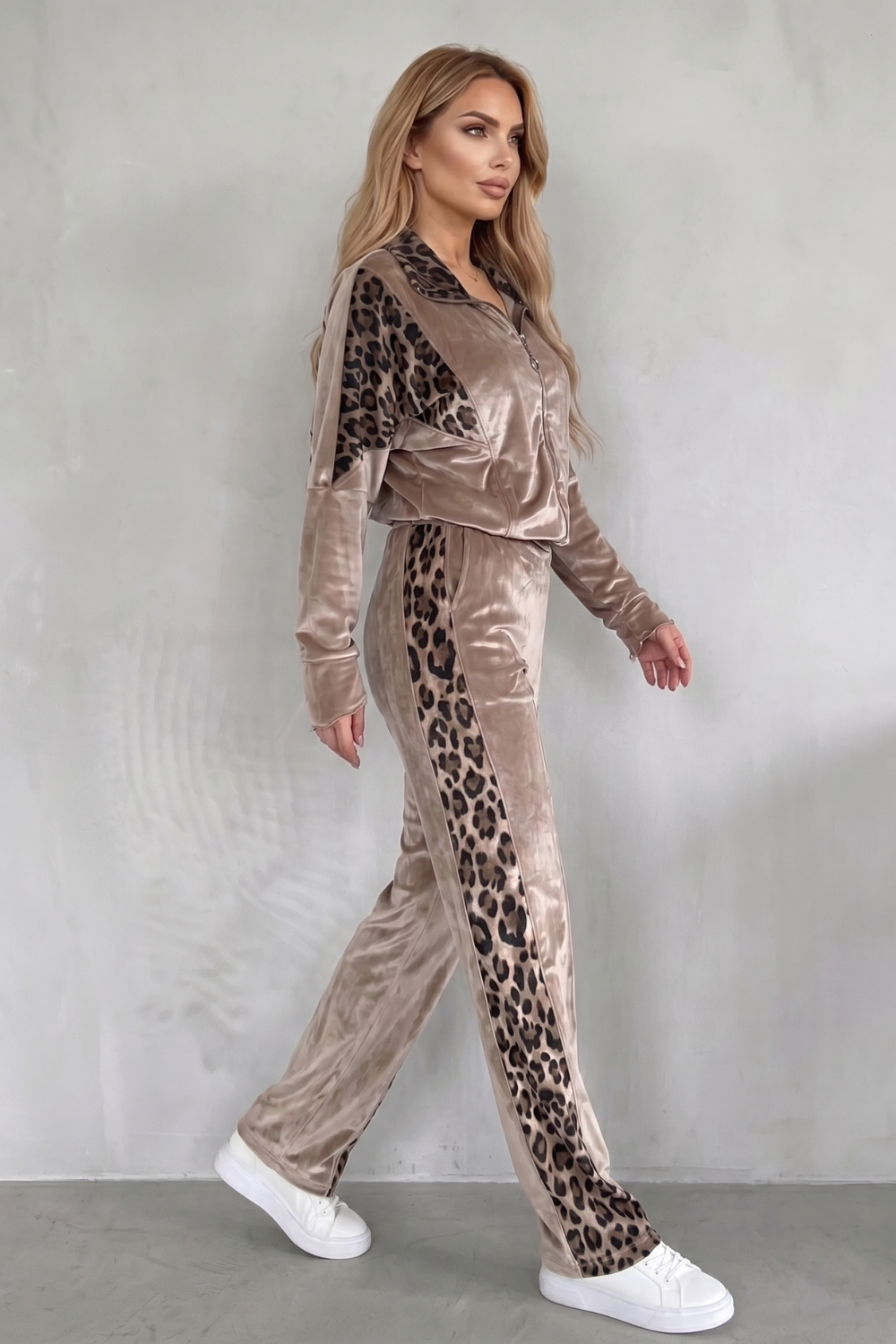 Back view of the three-piece leopard athleisure set showing the relaxed pant fit