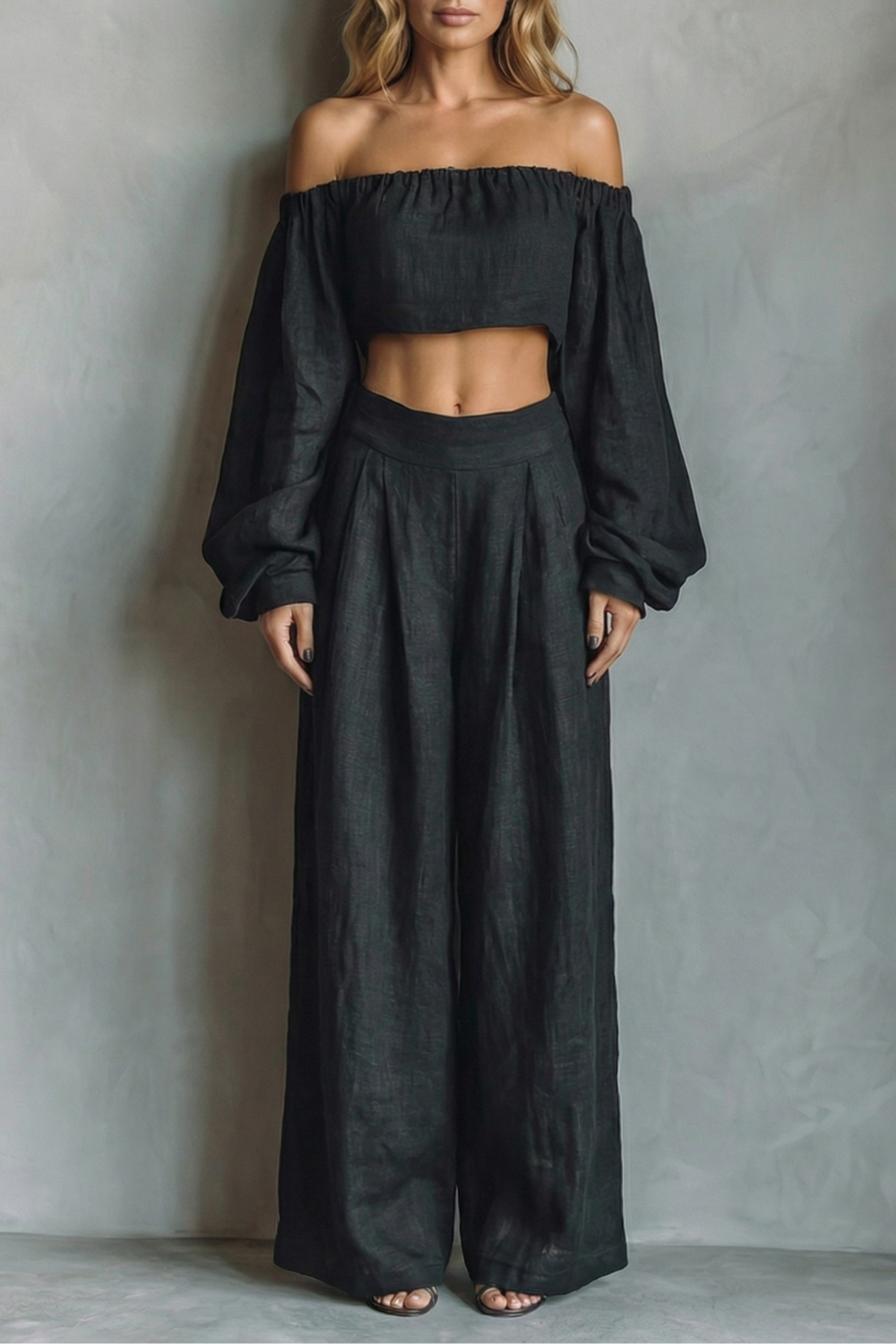 Women's off-shoulder crop top and wide-leg pants set in black, front view