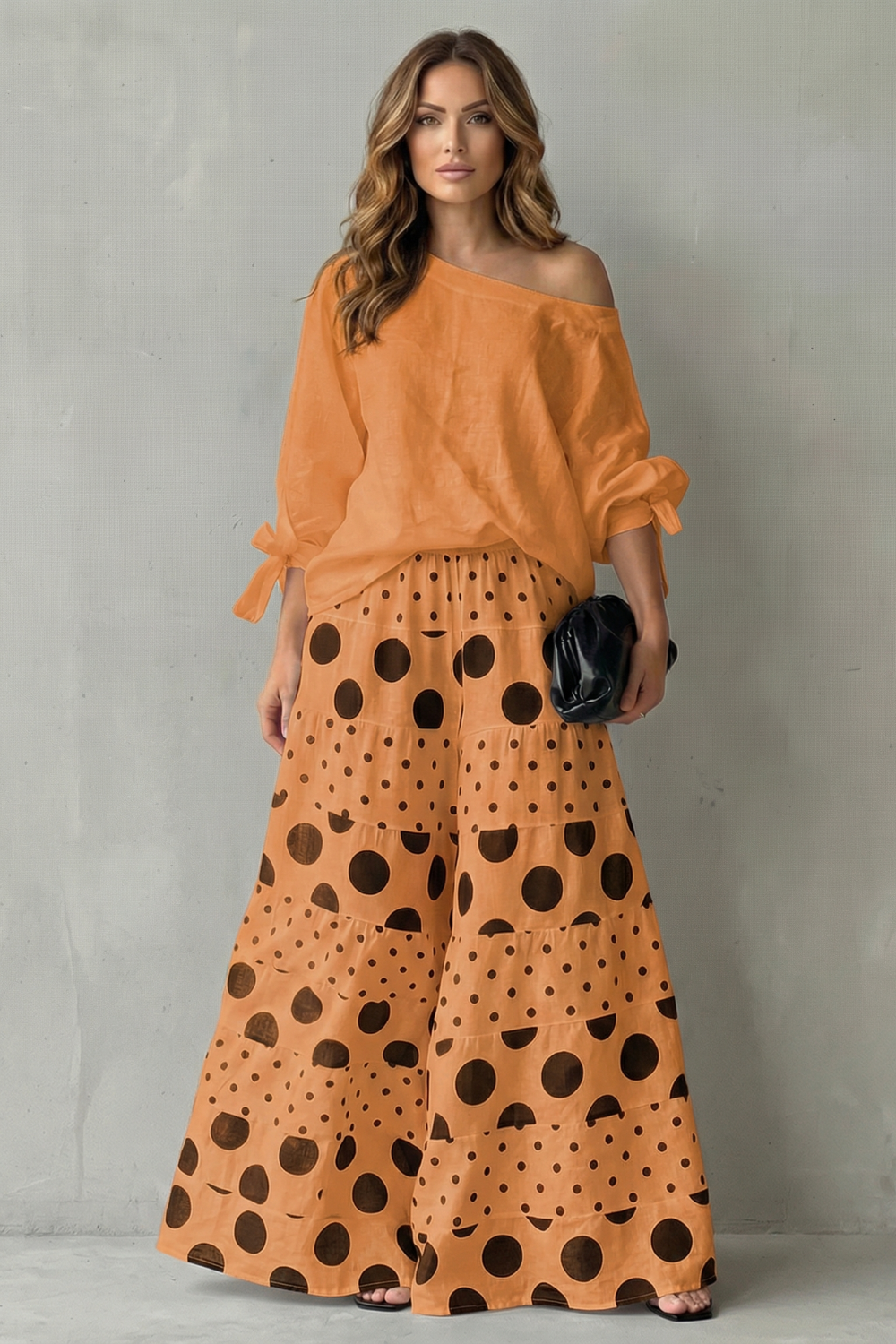 Polka dot two-piece set styled with heels and statement earrings for evening