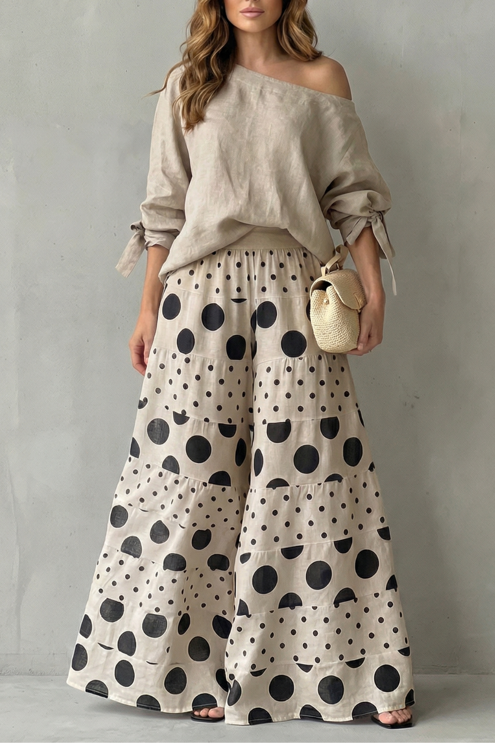 Black colorway of the polka dot top and wide-leg pants set, full-length view