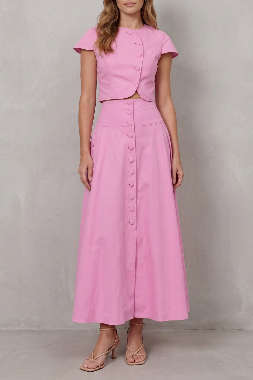 Women's cropped top and A-line maxi skirt set in pink, front view