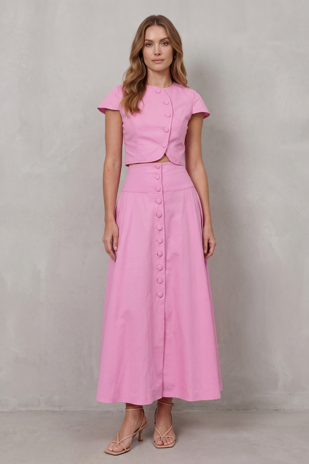 Side view of the tailored crop top and flowing A-line maxi skirt