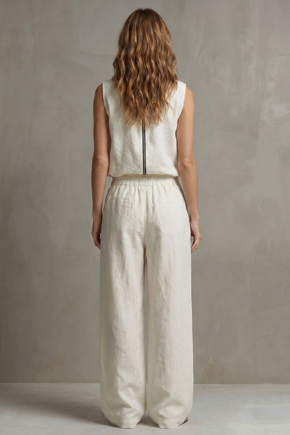 Detail close-up of the front zipper on the sleeveless top