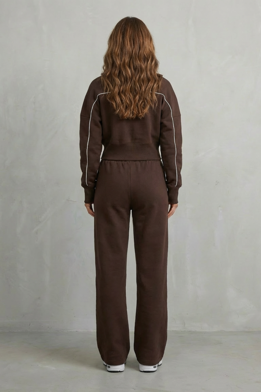 Detail close-up of the contrast piping along the zip-up jacket