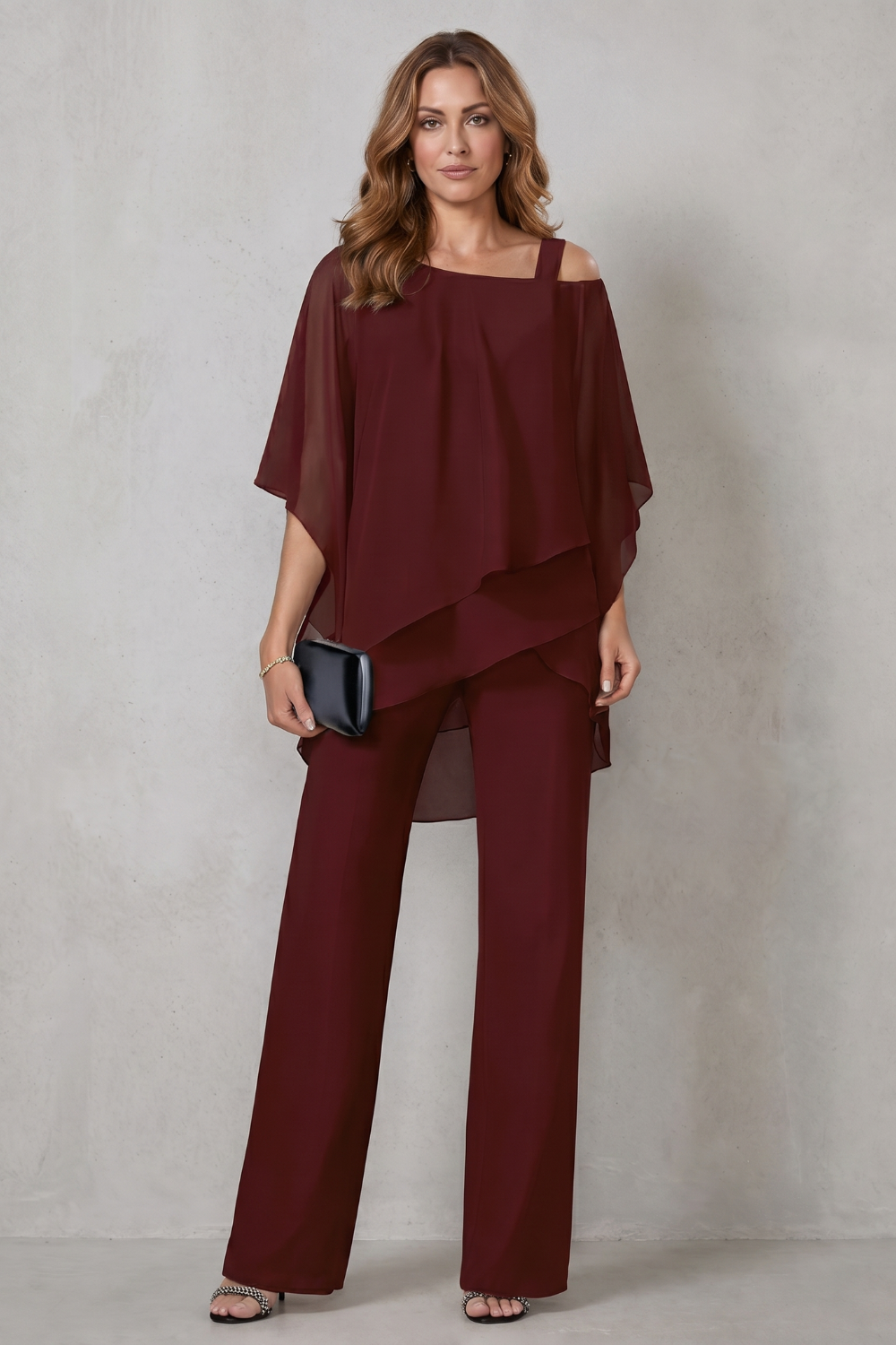 Movement shot showing the fluid drape of the wide-leg pants