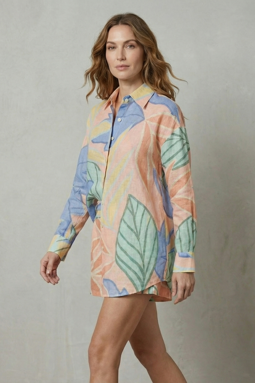 Detail close-up of the tropical leaf print and short sleeve cuff