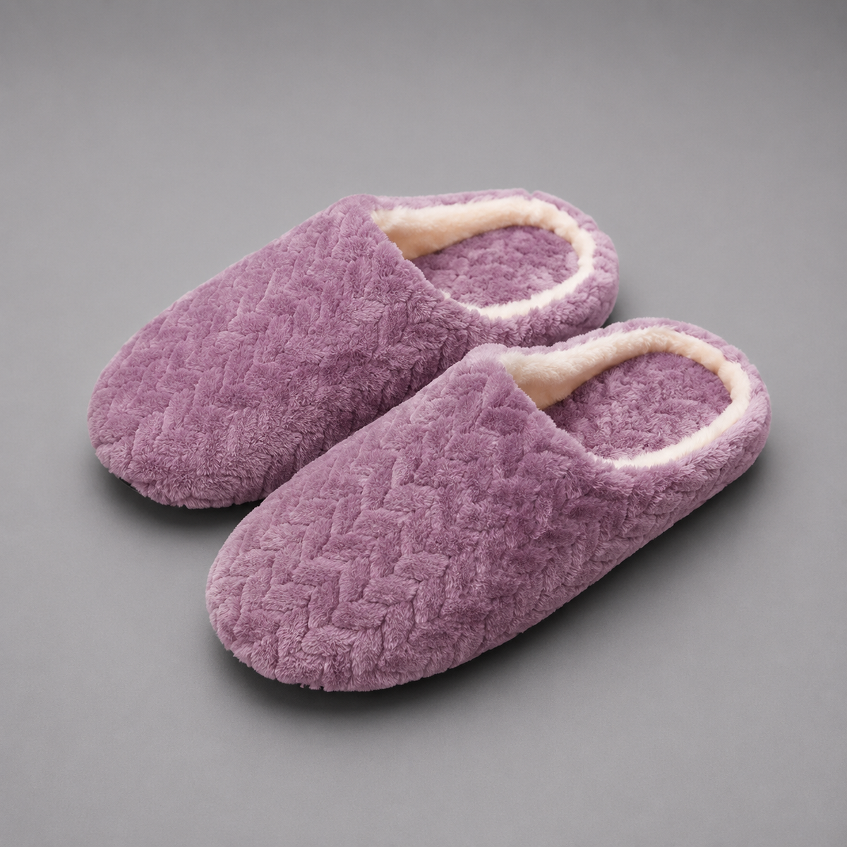 Unisex plush house slippers with a soft cloth upper, cozy lining, open-back slip-on design, cushioned sole, and non-slip outsole.