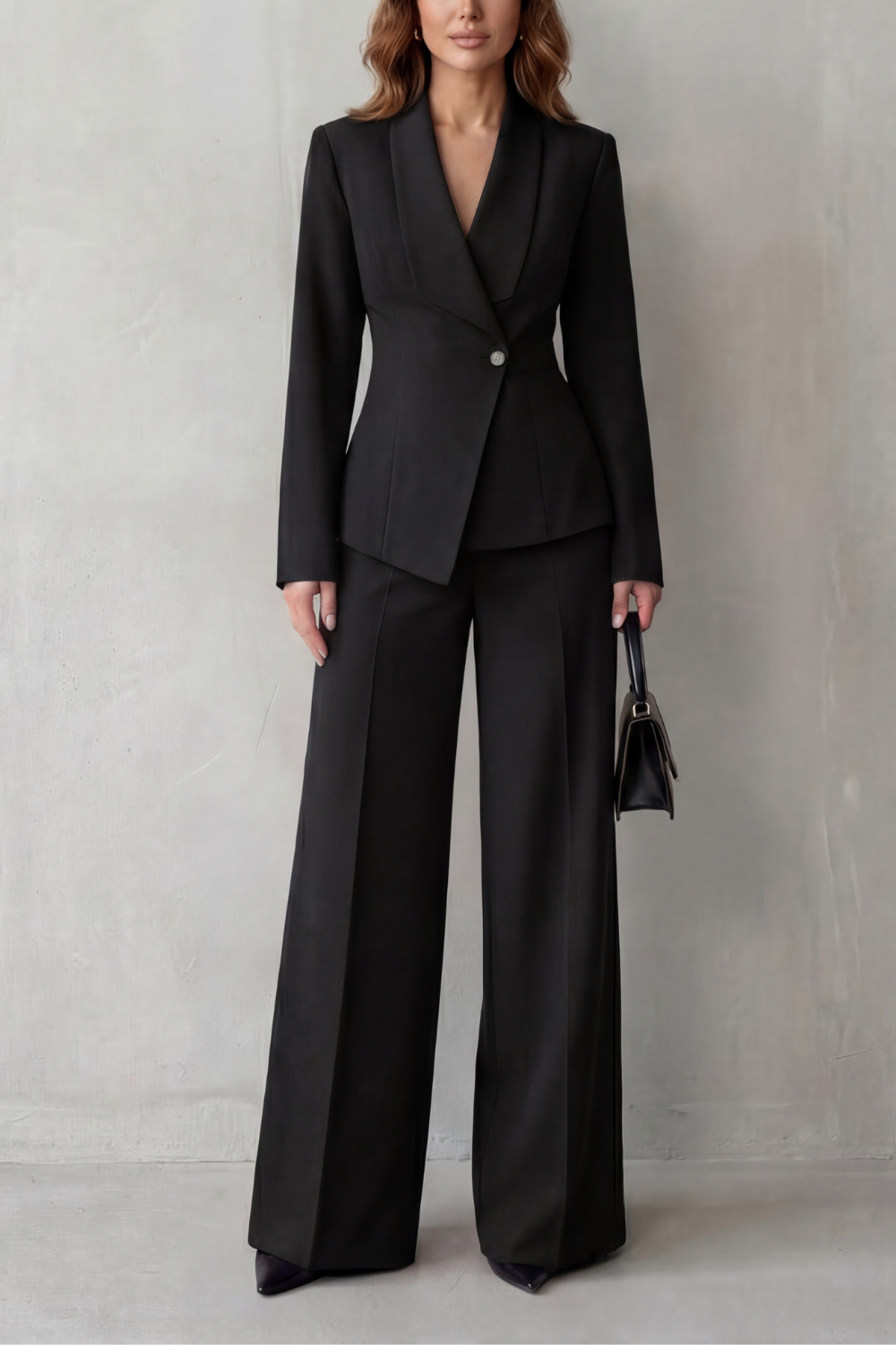 Close-up of the sculpted waist seaming on the tailored blazer