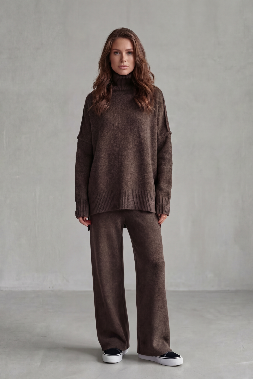 Detail of the ribbed sleeve and hem trim on the knit sweater