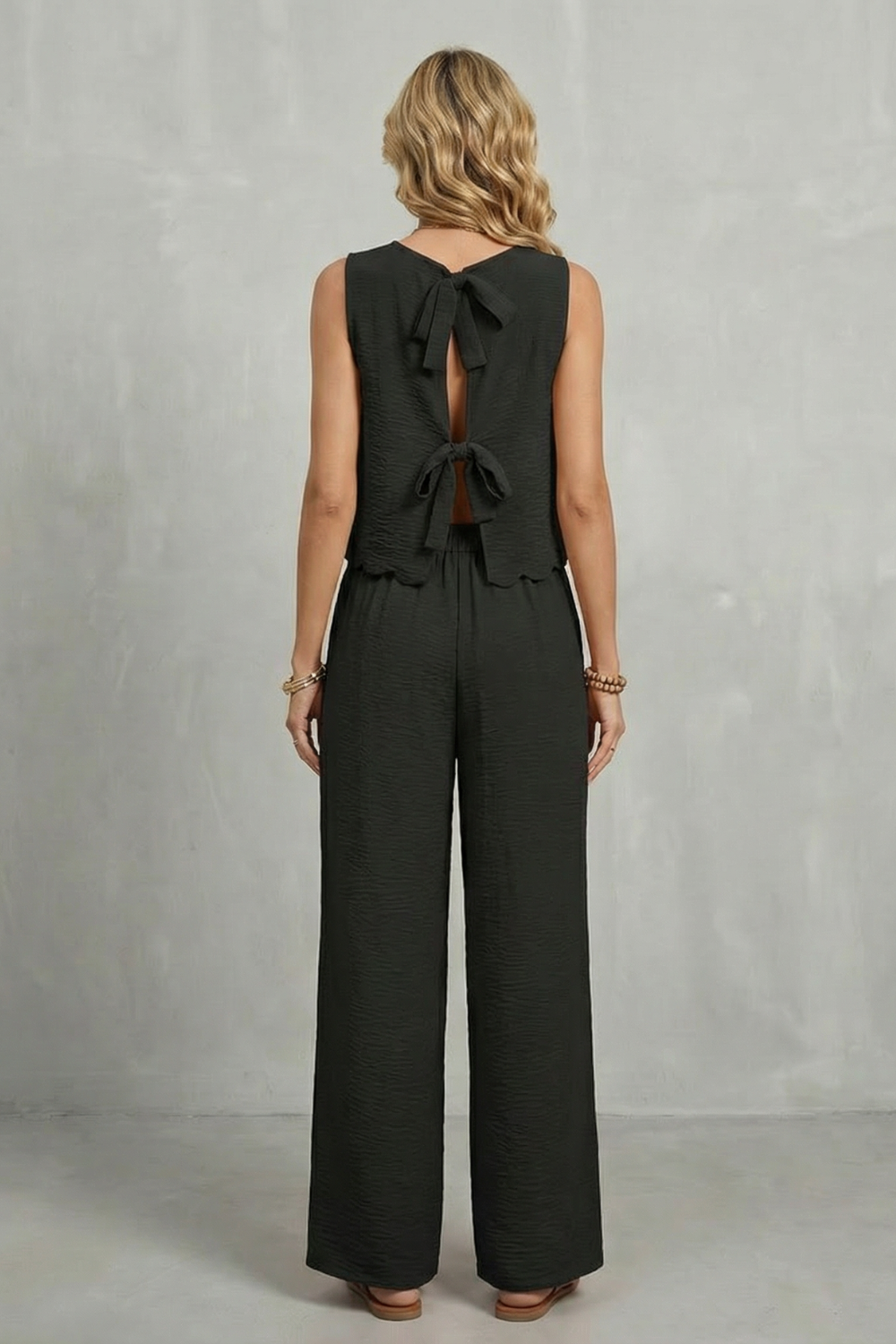 Detail close-up of the bow tie fastening on the open-back top