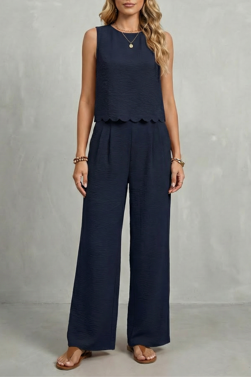 Detail close-up of the wide-leg pants hem and soft lined drape