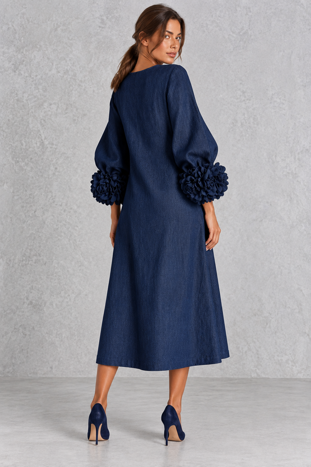 Women's floral maxi dress with lantern sleeves and button accents at the neckline.