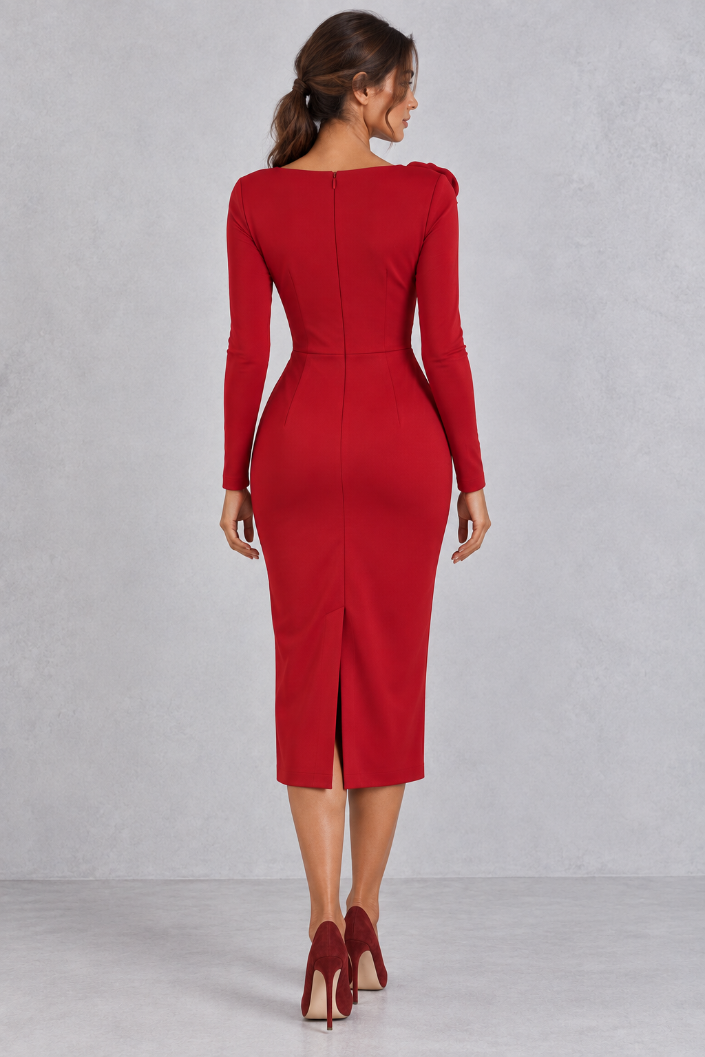 Model in an asymmetric one shoulder midi dress with ruched waist, styled for a holiday event.