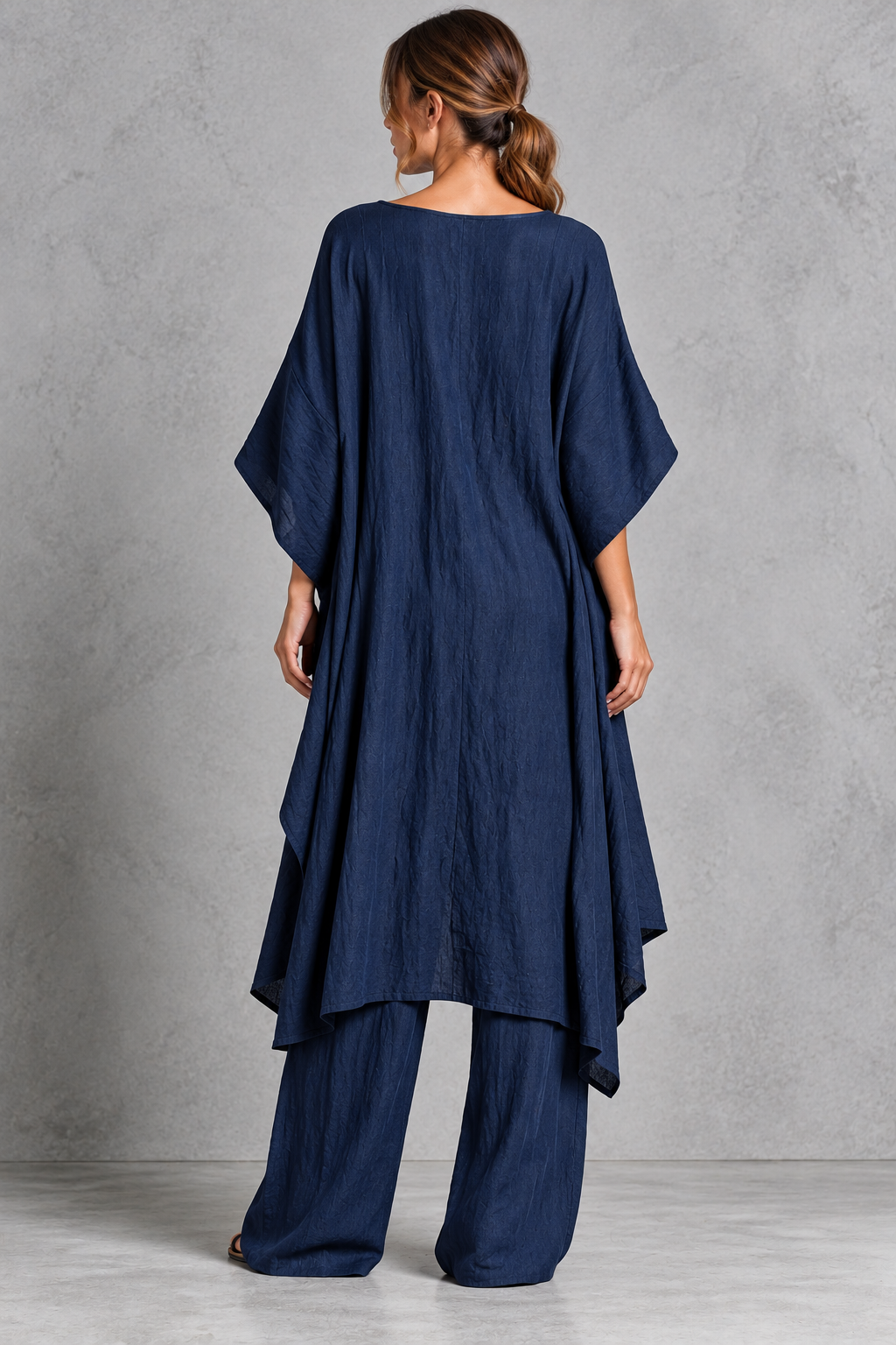 Overlapping split front and draped hem detail
