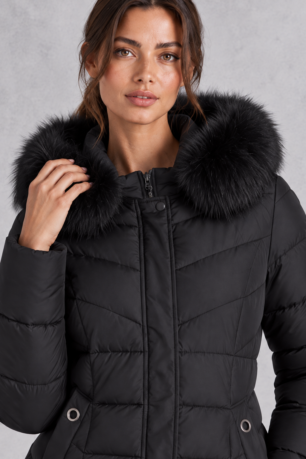 Close-up of faux fur-trimmed hood and high neckline